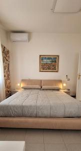 a bedroom with a large bed with lights on it at Rifugio collina del Sacro Cuore in Ascoli Piceno