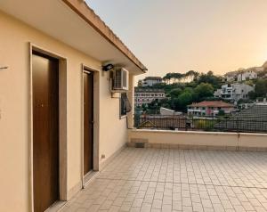 a balcony of a building with a view of a city at Rifugio collina del Sacro Cuore in Ascoli Piceno