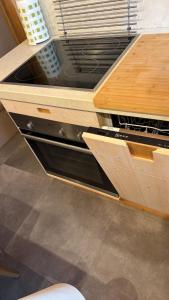 a kitchen with a stove top oven in a drawer at Duplex Esclusivo Bardonecchia - Centro - Garage in Bardonecchia +18 photos