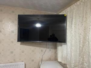 a person taking a picture of a mirror in a room at Ermihouse in Sheffield