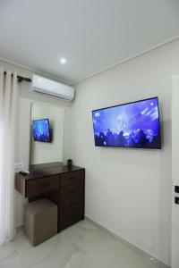 a living room with a flat screen tv on the wall at The Swan Nest 2 in Pogradec