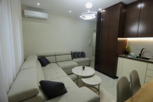 a living room with a couch and a table at The Swan Nest 2 in Pogradec