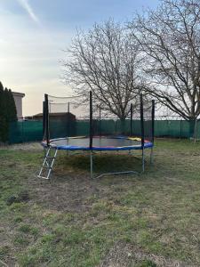 a trampoline in the grass in a field at Apartment PMS in Veľká Mača