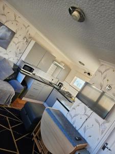 a view of a room with a surfboard in it at 116 cherry park in Chapel Saint Leonards