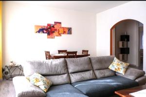a living room with a couch and a table at Casa Sacchet a Longarone in Longarone