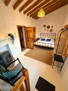 a bedroom with a bed and a bunk bed at Cortijo de las Piedras in Lubrín +44 photos
