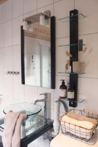 a bathroom with a sink and a mirror at Hus ved sjøen på Bømlo in Bømlo