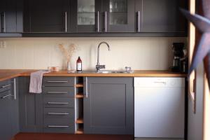 a kitchen with a sink and a counter top at Hus ved sjøen på Bømlo in Bømlo