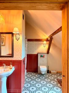 a bathroom with a sink and a toilet at Siedlisko Dobrych Snów in Stare Juchy +180 photos
