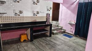 a bathroom with a sink and a toilet and a shower at MAHASATHI HOMESTAY Murdeshwar in Māvalli