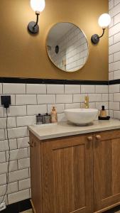 a bathroom with a sink and a mirror at Nieuwe Haven 23 in Dordrecht +53 photos