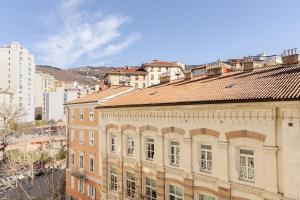 an old building in a city with buildings at Trieste Sweet in Trieste