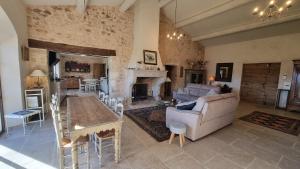 a living room with a couch and a table at La Fabrique in Gargas