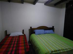 Postel nebo postele na pokoji v ubytování Posada De Los Santos Hotel Rural, La Candelaria