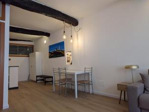 a dining room and living room with a table and chairs at Santo 41 in Vernazza