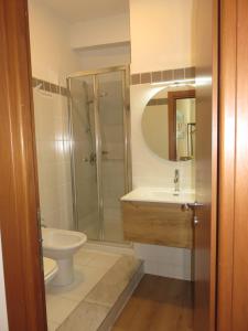 a bathroom with a shower and a sink and a toilet at Santo 41 in Vernazza +26 photos