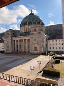 a large building with a green dome on top of it at Panorama Domblick in St. Blasien