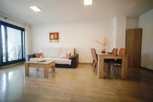 a living room with a couch and a table at Moraira Calamora in Moraira +40 photos