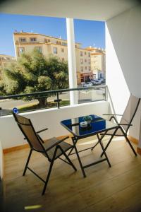 a table and chairs on a balcony with a view at Moraira Calamora in Moraira
