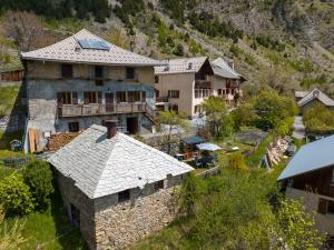 an aerial view of a large house in a village at Camp de Base - retraite d'exception 16 personnes in Les Orres