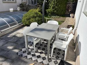 a table and four chairs on a patio at Haus Doris in Perchtoldsdorf