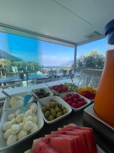 a buffet with different types of food on a table at Guesthouse Grand View in Malcesine