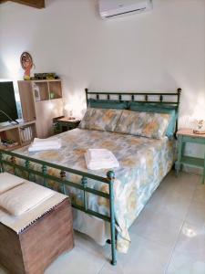a bedroom with a bed and a table and a tv at Il Colle in Treggiaia