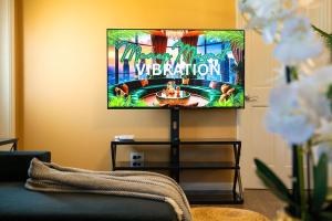 a living room with a flat screen tv on a wall at Vacation Haven in Rolleville
