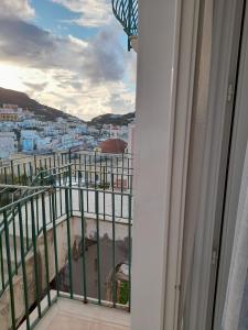 a balcony with a view of a city at Poseidone Ponza in Ponza