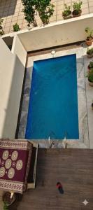 an overhead view of a swimming pool in a building at Silver Sand Resorts With Private Swimming Pool in Chennai