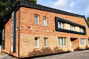 a red brick building with a black roof at eHostel Esztergom in Esztergom