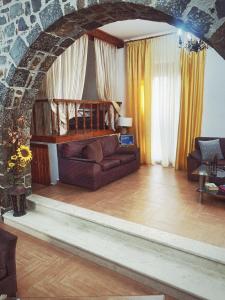 a living room with a couch and a table at Creta guesthouse ARXONTIKO! in Smárion +73 photos