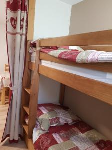 a couple of bunk beds in a room at Abondance studio la marmotte in Abondance