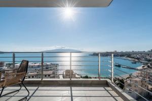 a balcony with a view of the water at Blue Eye Apartment in Sarandë