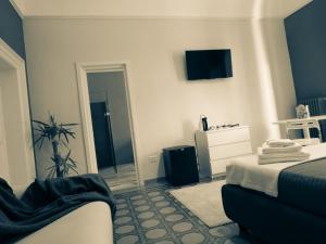 TV a/nebo společenská místnost v ubytování Ajde rooms & breakfast