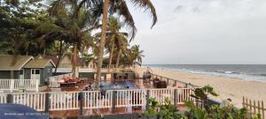 a view of a swimming pool on the beach at SunRise Beach Resort in Iberekodo