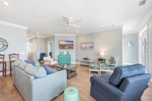 a living room with two couches and a table at Anchor Down Luxury Ocean View Beach House w Pool in Myrtle Beach