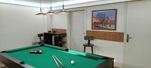 a billiard room with a pool table in it at Forrás-G Vendégház in Bük