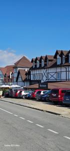 a row of cars parked in front of a building at Apt in the Sky - Kopaonik Kraljevi Čardaci in Kopaonik