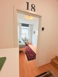 a living room with a number sign on the wall at Beenie 18 in Linz