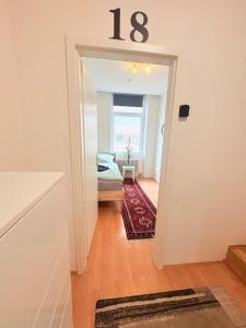 a room with a number sign on the door at Beenie 18 in Linz