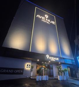 a building with a sign on the side of it at 9AVENUE hotel in Daegu