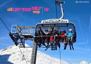 a group of people riding on a ski lift at Landhaus Kaulfuss in Sankt Jakob in Defereggen
