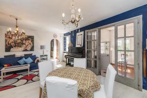 a living room with a table and a blue wall at Ca du Aldo - La Crema in Finale Ligure