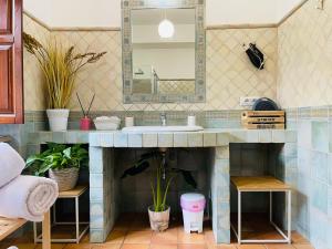 a bathroom with a sink and a mirror at Room24 Relax & Wellness in Genzano di Roma +32 photos