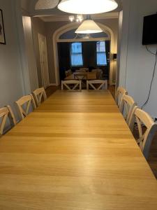 a conference room with a long table and chairs at Brussels EU District Mansion in Brussels