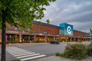 a car is parked in front of a building at Nordic Comfort Apartment in Trondheim