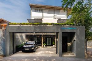 a car is parked inside of a garage at Lasantha's Residence in Kadawata
