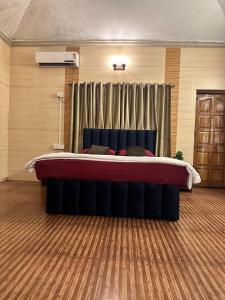 a bedroom with a large bed in a room at Vedanta Retreat in Igatpuri