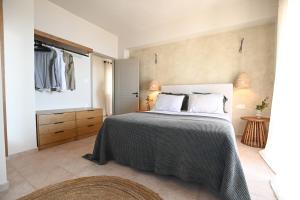 a bedroom with a large bed in a room at Villa Pothaia in Myrties